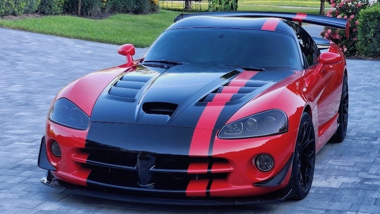 Dodge Viper ACR A red dodge viper with black racing stripe ready to hit the streets or the track.
